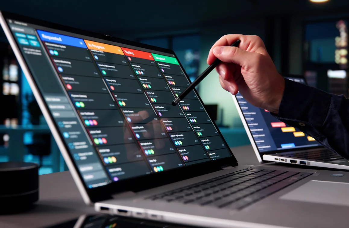Hand pointing at colorful digital interface